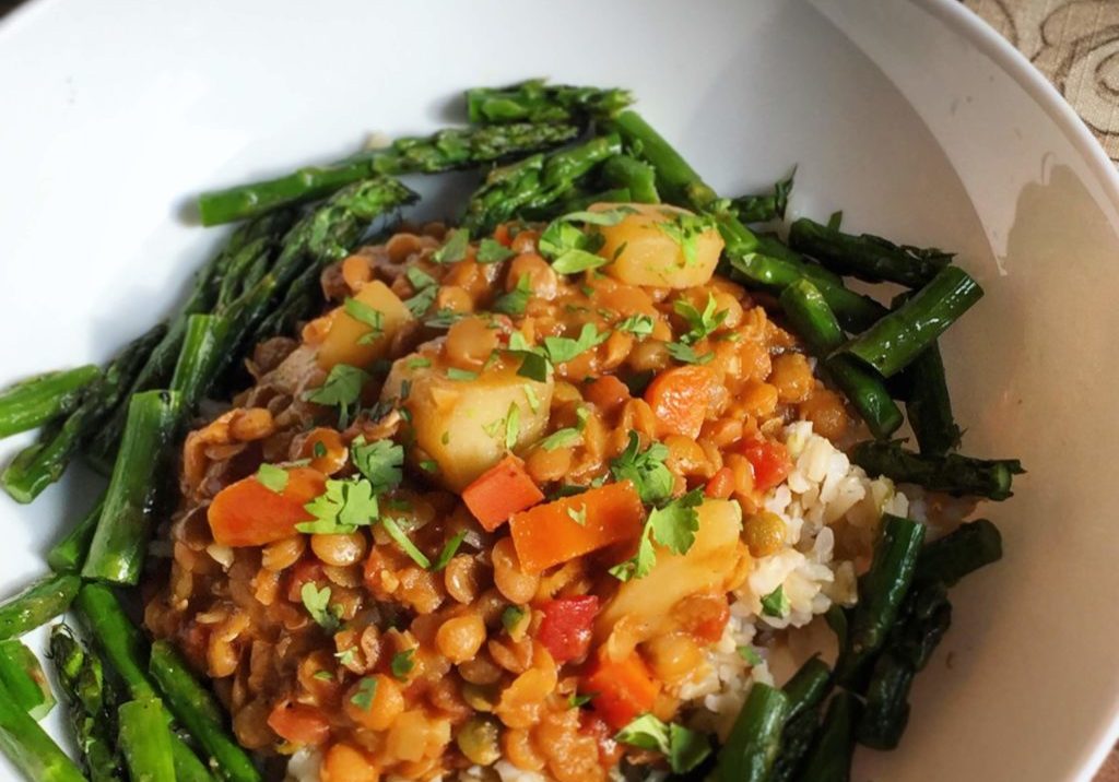 Delicious and flavorful lentil stew with roasted asparagus. 